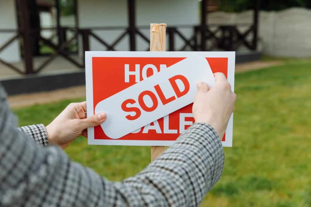 Sold Sign in front of house